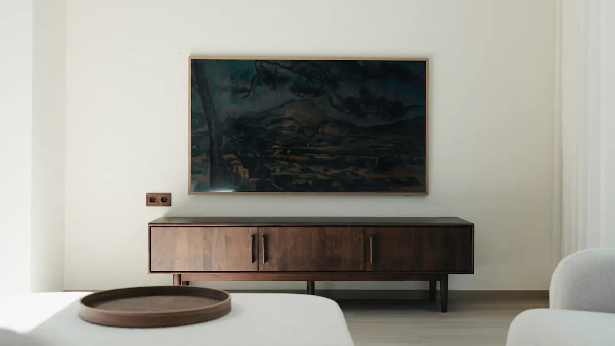 Wooden media console beneath a wall-mounted television in a styled living room.