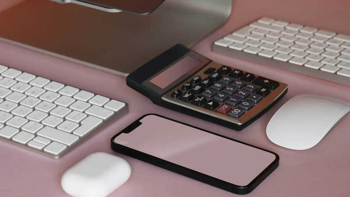 Desktop workspace with a keyboard, mouse, calculator and mobile device.